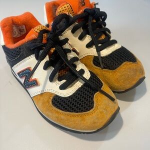 New Balance Kids' Black, Orange, and White Sneakers